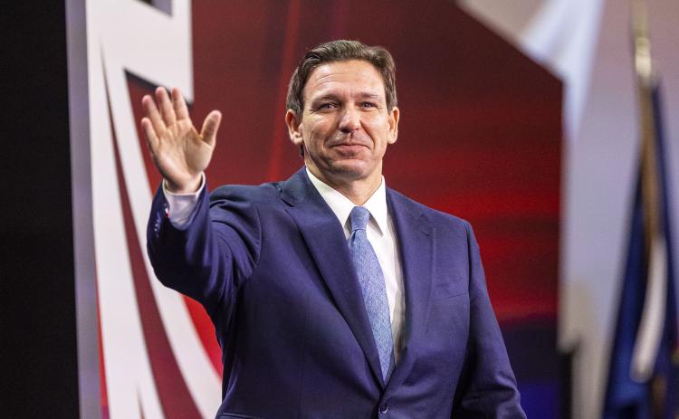 Florida Gov. Ron DeSantis waves while at the Pennsylvania Leadership Conference on April 1. (TYGER WILLIAMS/Philadelphia Inquirer/TNS)