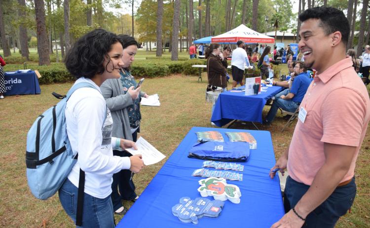 A college recruiter speaks with a prospective student at last year’s Florida Gateway College career fair and transfer day event. (COURTESY)