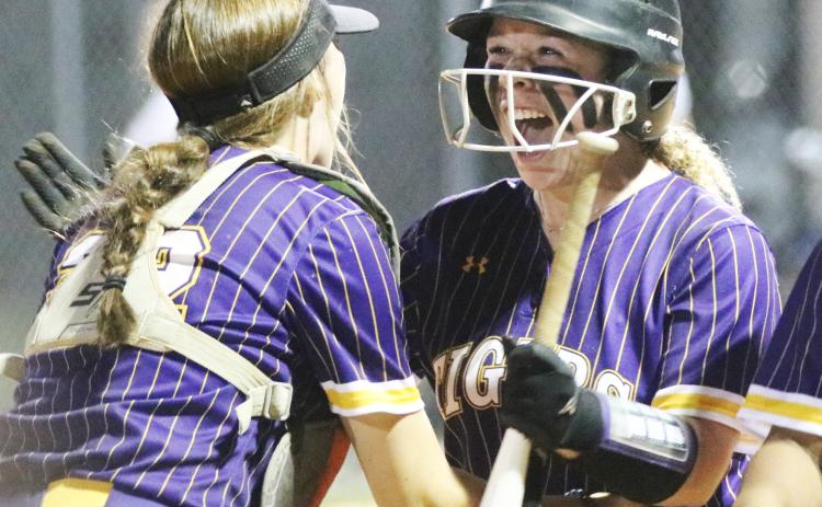 Columbia second baseman Alex Collins (right) celebrates with catcher Emily Delgado after hitting a walk-off RBI single against Taylor County on Thursday night. (JORDAN KROEGER/Lake City Reporter).