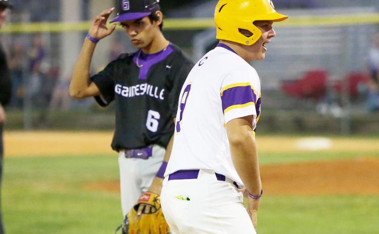 Columbia’s Waylon Fulford celebrates on third base after hitting an RBI triple against Gainesville on Friday night. It was Fulford’s first career hit. (BRENT KUYKENDALL/Lake City Reporter)