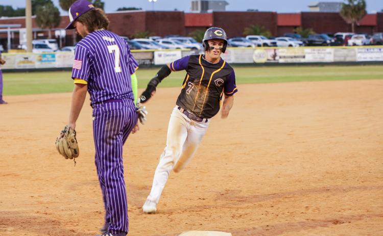 Columbia’s Hayden Gustavson turns off third base to head home for a run against Union County on Wednesday night. (BRENT KUYKENDALL/Lake City Reporter)
