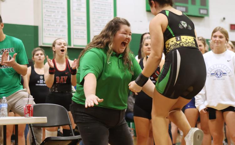 Suwannee head coach Brittney Shearer celebrates after Elisia Beauchamp completed her clean and jerk during the Region 1-1A meet on Feb. 4. (PAUL BUCHANAN/Special to the Reporter)