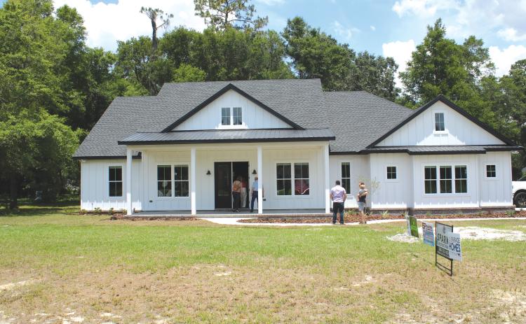 Folks wait to take a tour of one of the houses on the 2022 Parade of Homes route. This year’s Parade of Homes will run from April 29-30 and is free to the public to attend and tour. (FILE)