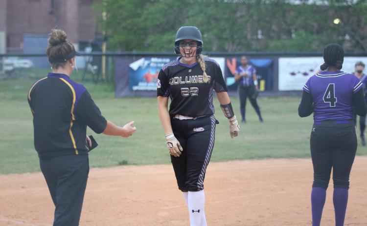 Columbia pitcher McKenna O’Sullivan celebrates on third after hitting an RBI double earlier in the first inning against Gainesville on Wednesday night. (JORDAN KROEGER/Lake City Reporter)