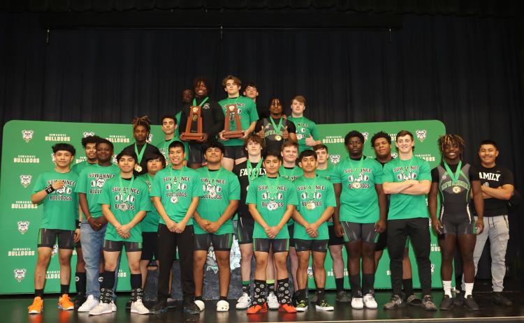 Suwannee’s weightlifting team poses with its two trophies after sweeping the District 5-1A titles on Friday. (PAUL BUCHANAN/Special to the Reporter)