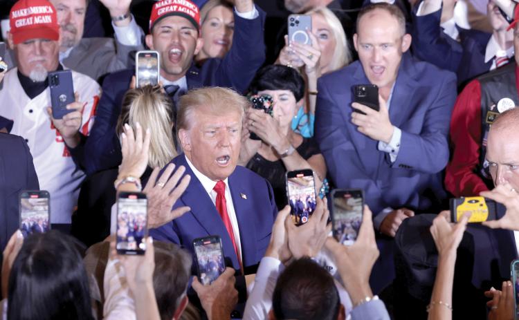 Former President Donald Trump arrives at an event at Mar-a-Lago on Tuesday in West Palm Beach after being arraigned on 34 felony counts earlier in the day. (ALEX WONG/Getty Images/TNS)