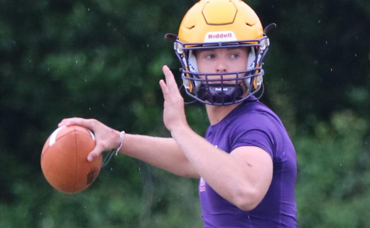 Columbia quarterback Evan Umstead drop backs to pass during Monday’s practice. (JORDAN KROEGER/Lake City Reporter)