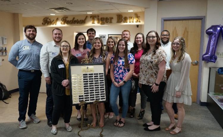 Past interns at the First Federal Tiger Bank at Columbia High School are pictured during the 15-year anniversary celebration. (COURTESY)