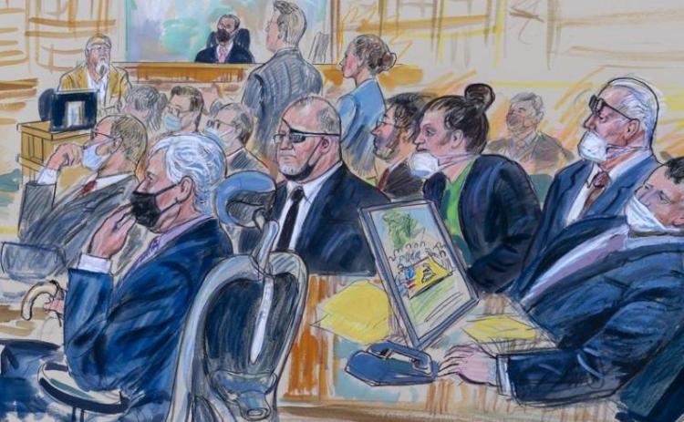 This artist sketch depicts the trial of Oath Keepers leader Stewart Rhodes and four others charged with seditious conspiracy in the Jan. 6, 2021, Capitol attack. Shown are Thomas Caldwell, seated front row left, Rhodes, seated second left with an eye patch, Jessica Watkins, seated third from right, Kelly Meggs, seated second from right, and Kenneth Harrelson, seated at right. (AP File)