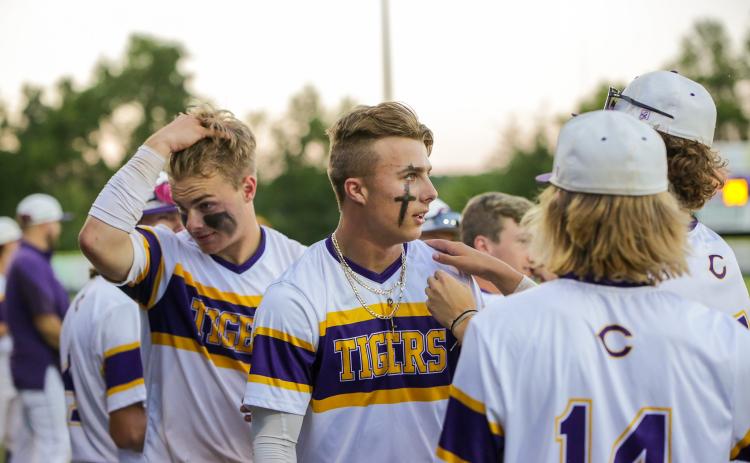 Columbia players regroup in the dugout after Camdon Frier (middle) hit a home run against Lincoln in the District 2-5A championship on Wednesday. (BRENT KUYKENDALL/Lake City Reporter)