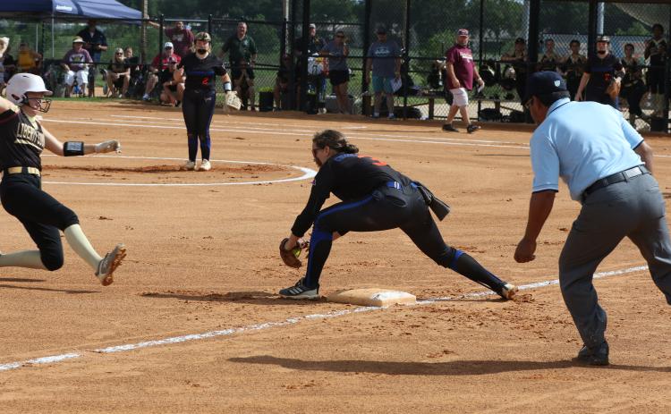 Branford shortstop Cloey Criggall is called for obstruction after tagging out Liberty County second baseman Gabriella Flowers during Wednesday’s Class 1A state championship game at Legends Way Ballfields in Clermont. (MORGAN MCMULLEN/Lake City Reporter)