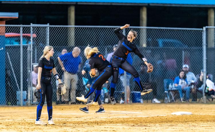 Branford pitcher Laila Arnold (left) celebrates with shortstop Cloey Criggall after the Buccaneers topped Aucilla Christian 2-0 to advance to the Class 1A Final Four. (JACK HOWDESHELL/Special to the Reporter)