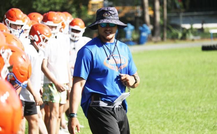 Branford head coach Tim Clark watches over conditioning at the end of practice on May 4. (JAMIE WACHTER/Lake City Reporter)