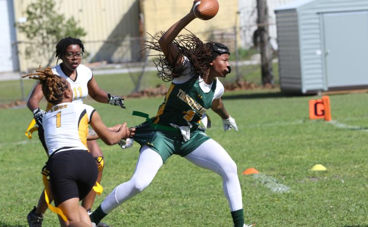 FGC receiver Destiny Lockett splits a pair of Xavier defenders on Feb. 25. (JAMIE WACHTER/Lake City Reporter)