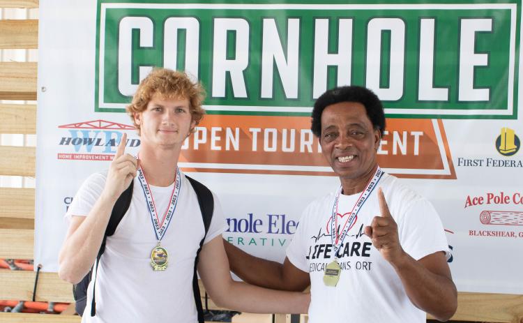 Ricky Nicky, the team of Lake City’s Nick Wilkerson (left) and Ricky Jernigan, won the competitive division at the Suwannee Valley Cornhole Tournament. (COURTESY)