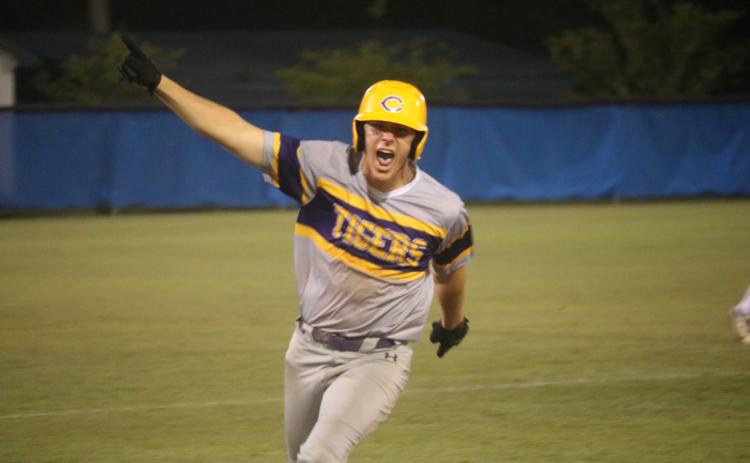 Columbia’s Ayden Phillips celebrates as he approaches third base on his grand slam in the seventh inning Tuesday at Clay. (JORDAN KROEGER/Lake City Reporter)