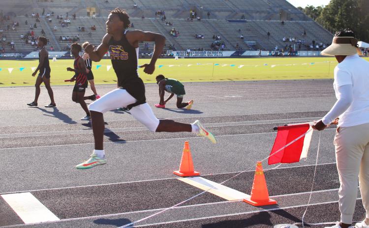 Columbia’s Seth Stockton competes in the triple jump at the Region 1-3A meet on Thursday. Stockton won the title with a leap of 14.66m. (COURTESY)