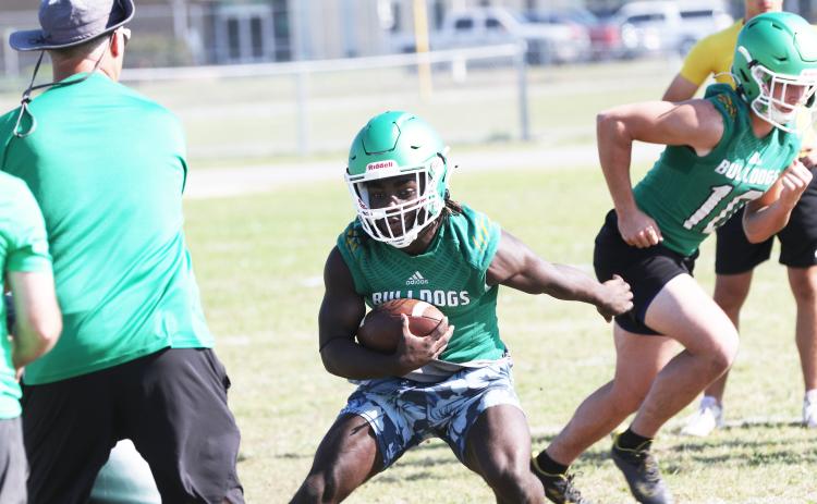 Suwannee running back Marquavious Owens rushes up the field during practice on May 1. (JAMIE WACHTER/Lake City Reporter)