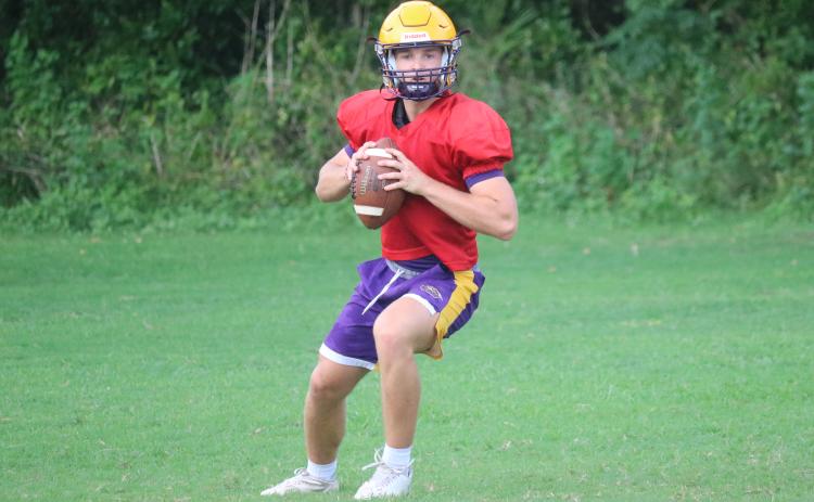 Columbia quarterback Evan Umstead drops back to pass during practice on Wednesday. (JORDAN KROEGER/Lake City Reporter)