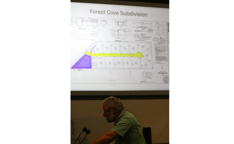 Assistant County Manager Kevin Kirby discusses the county’s design and maintenance manual for subdivisions Thursday as an example for how MSBUs would work using the Forest Cove subdivision is shown behind him. (JAMIE WACHTER/Lake City Reporter)