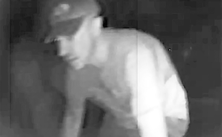 A potential suspect is shown in video surveillance from a semi-tractor that had its tires punctured. (COURTESY)