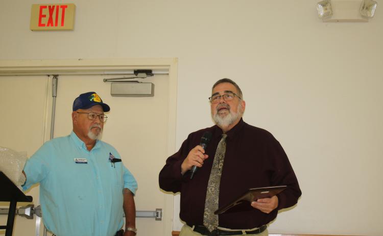 Columbia County Manager David Kraus speaks Tuesday after receiving the Columbia County Farm Bureau’s Public Service Award from Richard Jones. (TONY BRITT/Lake City Reporter)