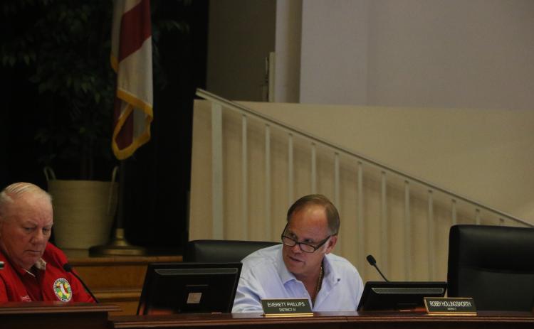 Columbia County Commissioner Robby Hollingsworth (right) speaks next to Commissioner Everett Phillips during Waste Pro’s presentation at the commission’s meeting Thursday night. (MORGAN MCMULLEN/Lake City Reporter)