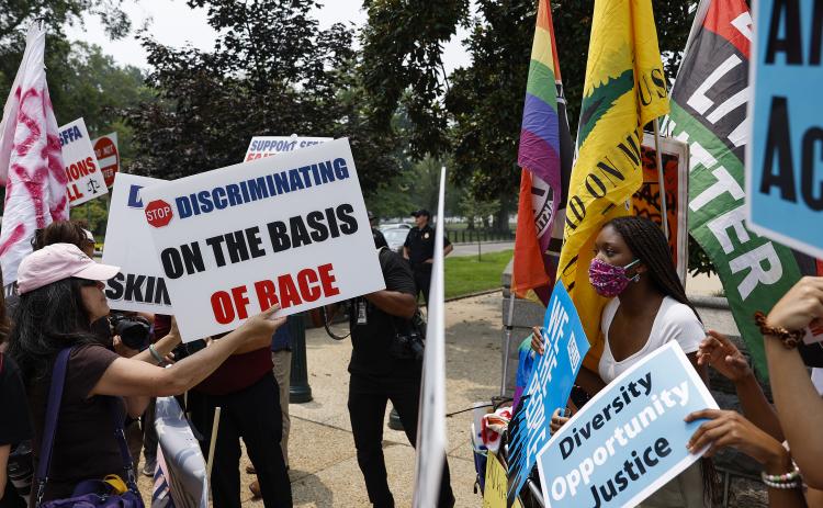Protesters for and against affirmative active demonstrate on Capitol Hill on Thursday in Washington, D.C. (ANNA MONEYMAKER/Getty Images/TNS)