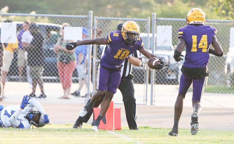 Columbia receiver Zamarion Jones (10) celebrates with receiver Jasper White (14) after scoring a touchdown against Bartram Trail during the teams’ spring game on May 19. (BRENT KUYKENDALL/Lake City Reporter)