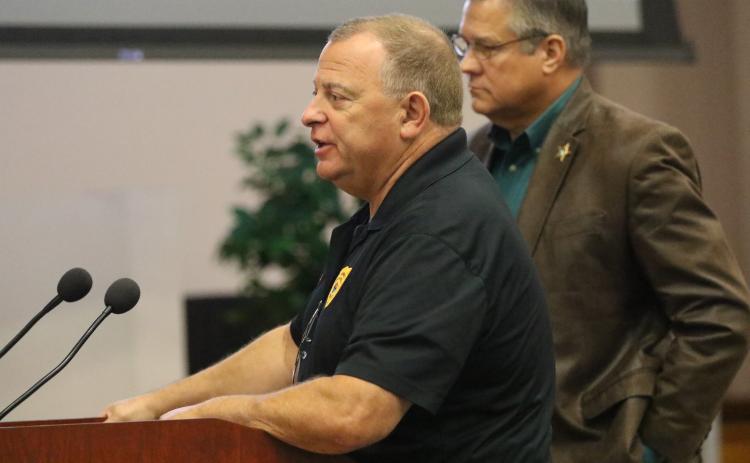 Lake City Police Chief Gerald Butler answers questions from the Columbia County Commission about consolidating dispatch Thursday as Sheriff Mark Hunter looks on. (JAMIE WACHTER/Lake City Reporter)
