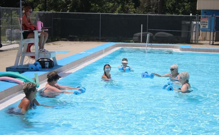 Lifeguard Rachel Douberley leads a water aerobics class at the Jared Allison Aquatic Complex. (TONY BRITT/Lake City Reporter)