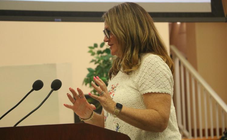 Richardson Community Center Board Treasurer Tammy Magstadt discusses programming at the center with the Columbia County Commission on Thursday. (MORGAN MCMULLEN/Lake City Reporter)