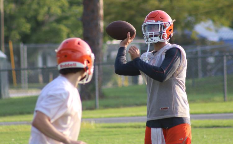 Branford quarterback Thomas Sikes throws a pass during Monday’s practice. (JAMIE WACHTER/Lake City Reporter)