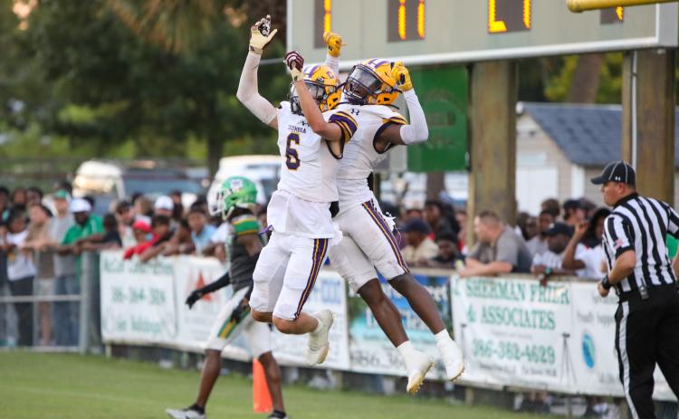Columbia receivers Bynton Edge (left) and Zamarion Jones (right) celebrates after Jones caught a touchdown pass against Suwannee in last Friday’s Preseason Classic. (BRENT KUYKENDALL/Lake City Reporter)