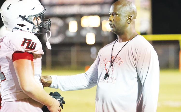 Fort White head coach Demetric Jackson talks with a player during Friday’s jamboree at Trenton. (PAUL BUCHANAN/Special to the Reporter)