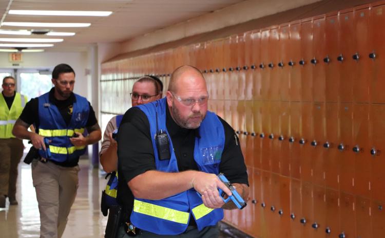 First responders walk through the halls of Columbia High School during an active shooter training this week. (COURTESY)