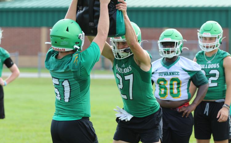 Suwannee defensive end Sam Wainwright performs a drill during Monday’s practice. (JAMIE WACHTER/Lake City Reporter)