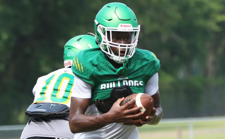 Suwannee receiver MJ Rossin runs up the field after a catch during Friday’s practice. (JAMIE WACHTER/Lake City Reporter)