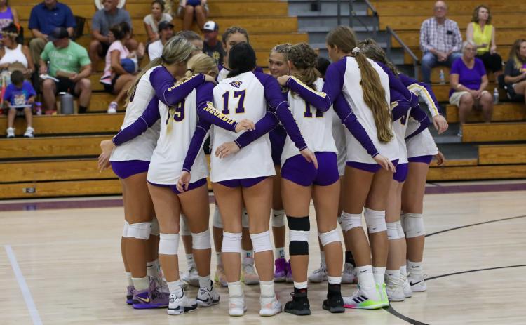 Columbia huddles prior to a tri-match against Branford and Valdosta on Aug. 22. (BRENT KUYKENDALL/Lake City Reporter)