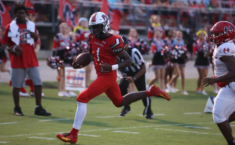 Fort White running back Dakota Fisher heads to the end zone on one of his three touchdowns Friday night against Hamilton County. (PAUL BUCHANAN/Special to the Reporter)