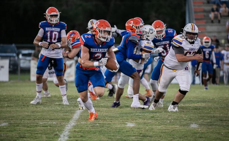 Branford running back Trevor Maddox takes a carry up the field against Bell on Saturday. (ERIN ROBERTS/Special to the Reporter)