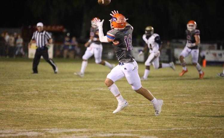 Branford wide receiver Austin Malaguti hauls in a pass Friday night against Paxon. (ERIN ROBERTS/Special to the Reporter)