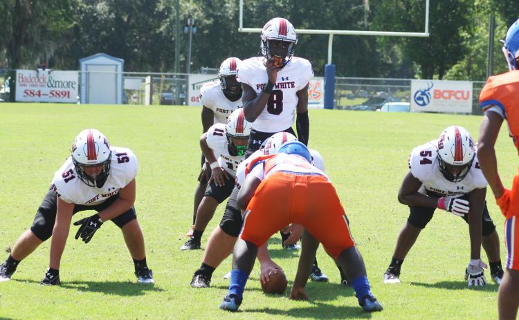 Fort White quarterback Jayden Jackson gets set for the snap against Taylor County on Aug. 26. (JAMIE WACHTER/Lake City Reporter)