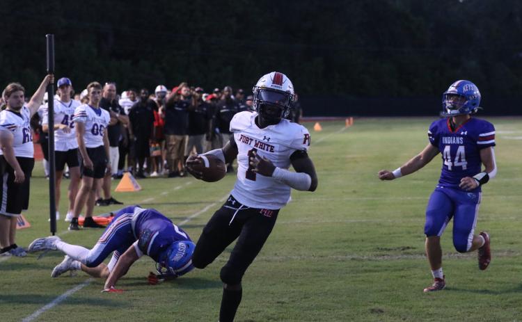 Fort White running back Dakota Fisher takes in a rushing touchdown Friday at Keystone Heights. (MORGAN MCMULLEN/Lake City Reporter)