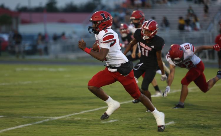 Lafayette quarterback Tywan Williamson races upfield during Friday’s 53-6 win over Hamilton County. (PAUL BUCHANAN/Special to the Reporter)