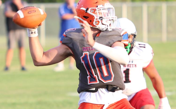 Branford quarterback Thomas Sikes drops back to pass against Fort White during the teams’ Preseason Jamboree on Aug. 18. (PAUL BUCHANAN/Special to the Reporter)