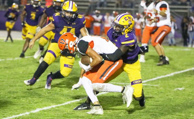 Columbia defensive back D’Mari Bruce tackles Orange Park receiver Ryder Fulmer on Friday night. (BRENT KUYKENDALL/Lake City Reporter)