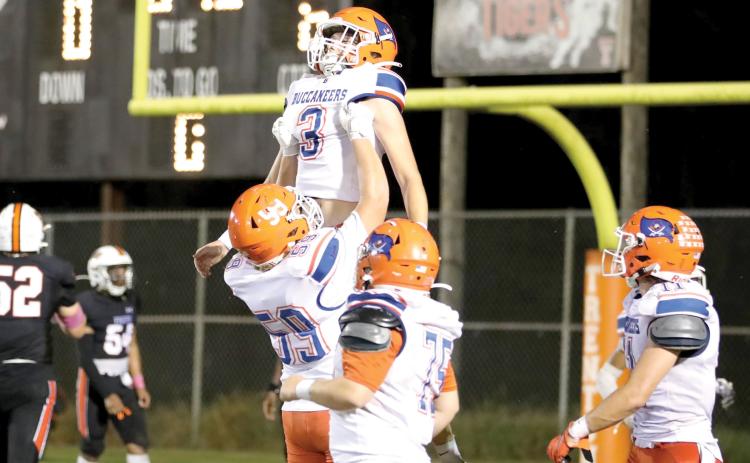 Branford wide receiver Haiden Ward and offensive lineman Sabastian Waugama celebrate after Ward’s touchdown in the second quarter Friday against Trenton. (ERIN ROBERTS/Special to the Reporter)