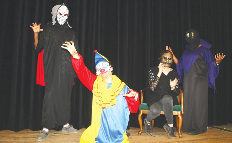 The Creepy Crew featuring Michael Davis as the Oogey ‘Boogey Man,’ Jeremias Sandoval as the ‘Creepy Clown,’ Annika Hunt as ‘Creepy Doll Face’ and Keptia Josma as ‘The Alien,’ will serve up frights and scares at the Columbia High School theatre’s program presentation of Scary Stories on Friday and Saturday night. (TONY BRITT/Lake City Reporter)