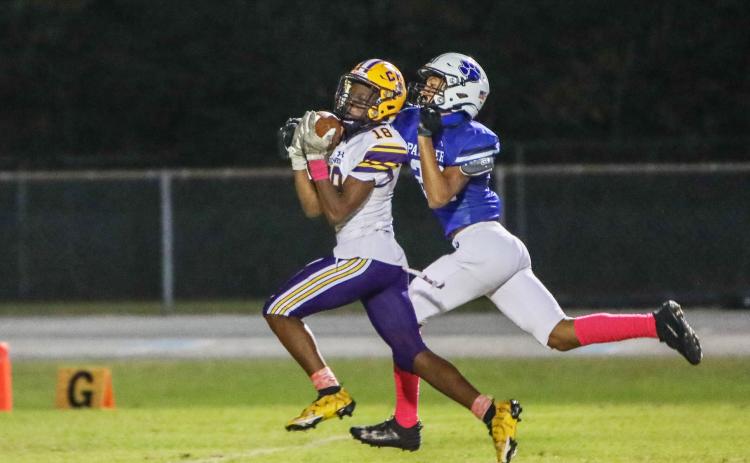Columbia receiver Marlin Haywood catches a touchdown pass against Ridgeview on Friday night. (BRENT KUYKENDALL/Lake City Reporter)